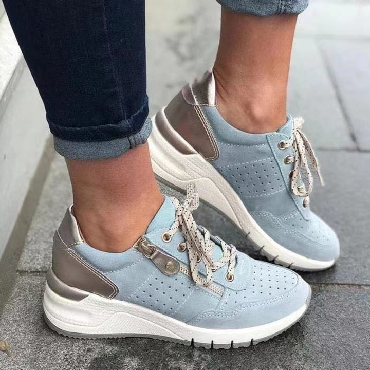 Everyday women's comfort sneakers: wedge platform, lace-up design with side zip for easy wear.