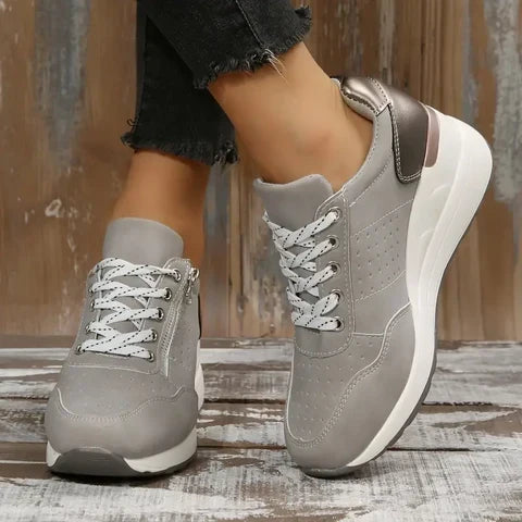 Stylish wedge platform women's sneakers, lace-up and side zip, perforated for everyday walking.