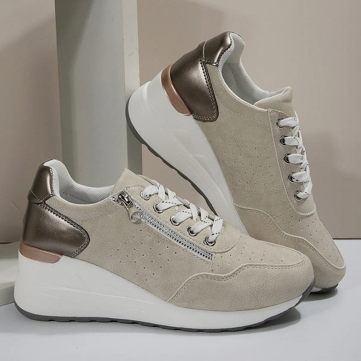 Women's comfort footwear: wedge platform walking sneakers with lace-up and side zip features.