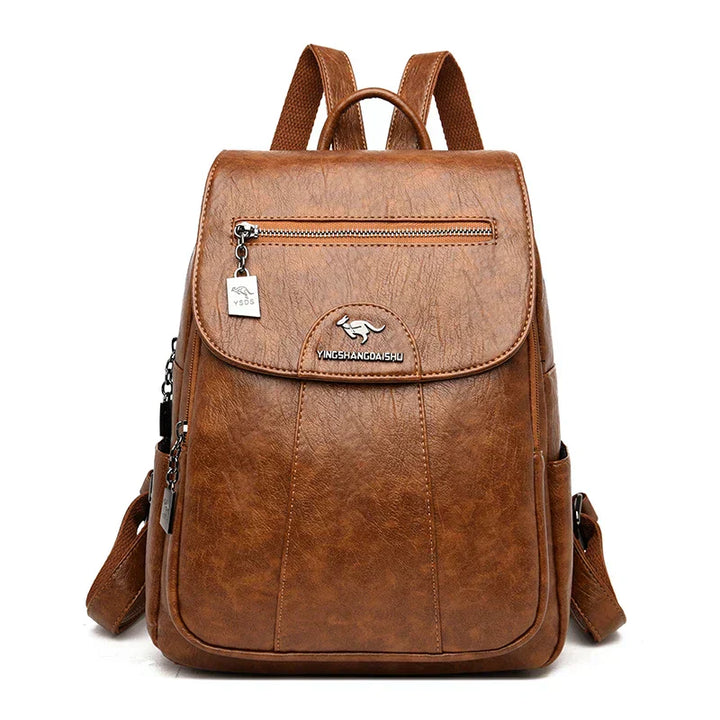 Close-up of the theft protection zipper on a women's leather backpack.