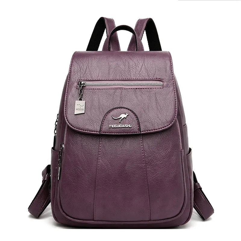 Model wearing a large leather backpack, showcasing its stylish design.