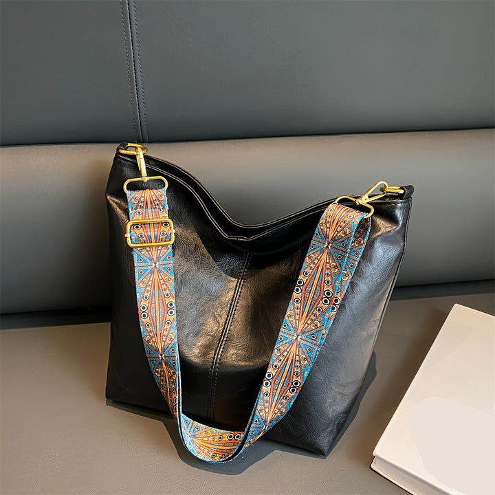 Luxury genuine leather handbag for women, offering large capacity and sophisticated style.