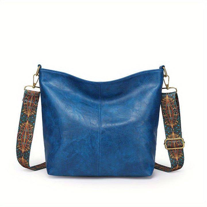 Elegant genuine leather women's handbag, large capacity for organized and stylish carrying.