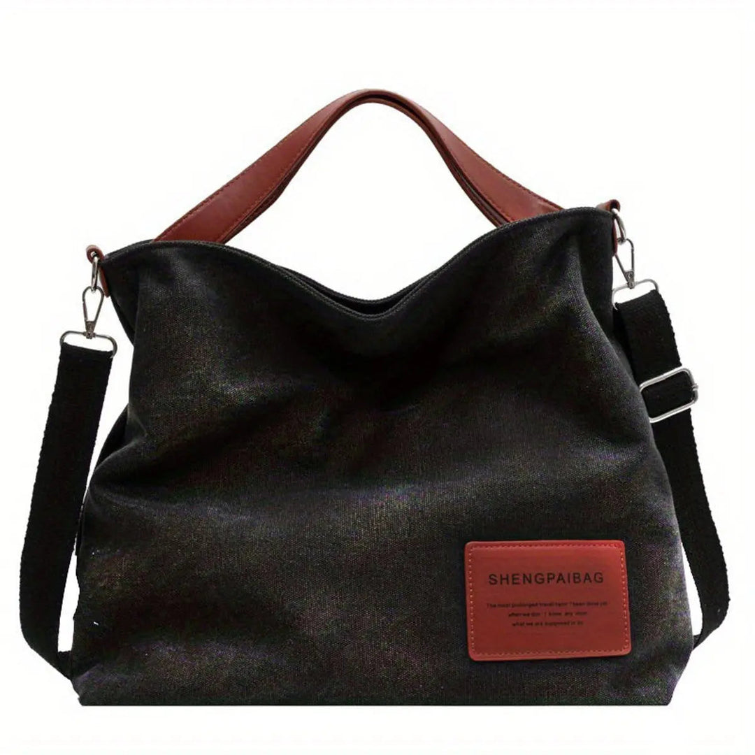 Versatile women's large slouchy canvas tote bag with an adjustable strap, available in cream. Ideal for everyday carry.