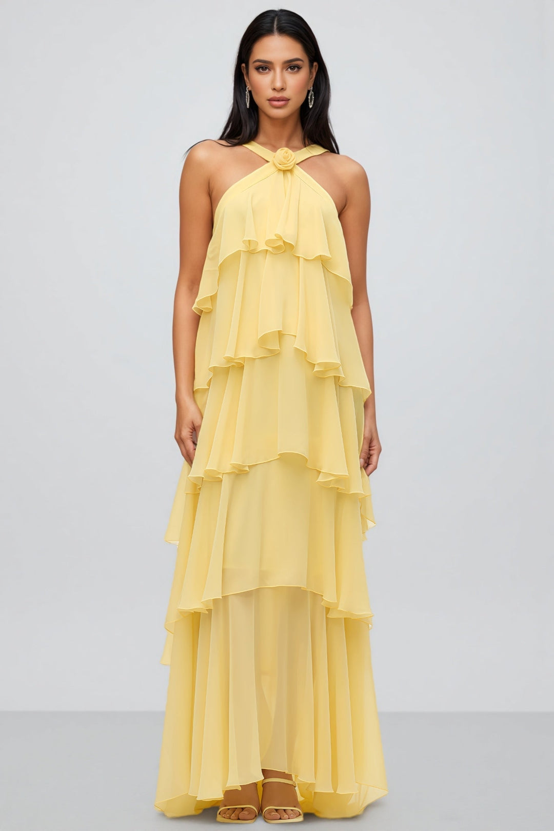 Elegant women's yellow tiered maxi dress featuring a halter neck and mermaid silhouette, ideal for formal parties.