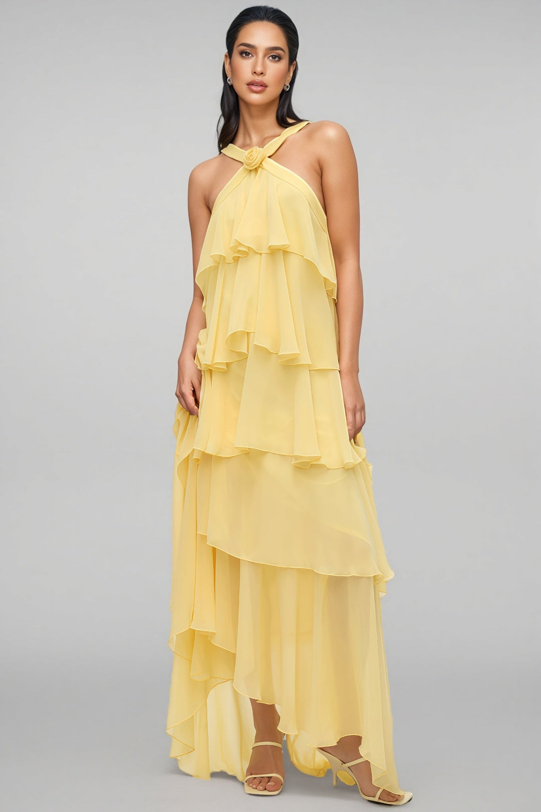 Beautiful women's yellow tiered maxi dress with a halter neck for wedding guests & formal summer occasions.