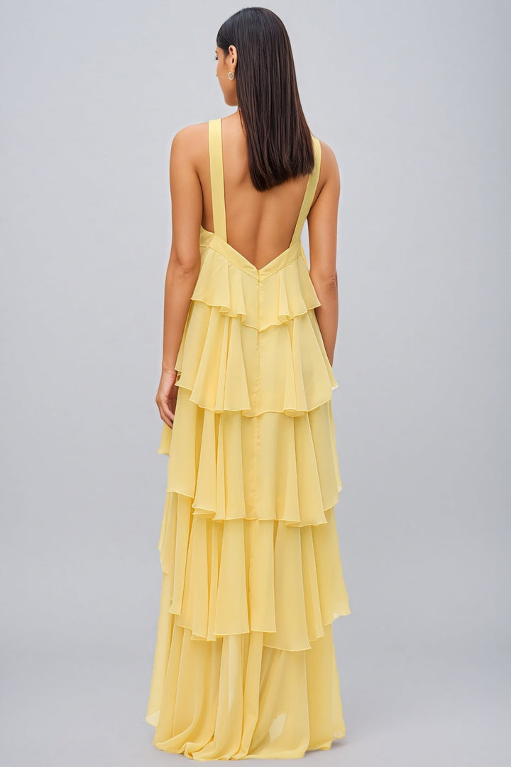 Glamorous women's yellow halter neck layered maxi dress, perfect as a statement piece for special occasion wear.