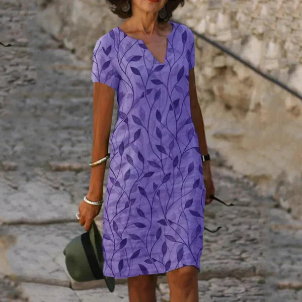 Casual women's leaf print v-neck mini dress. A comfortable short summer dress, great for vacation or everyday style.