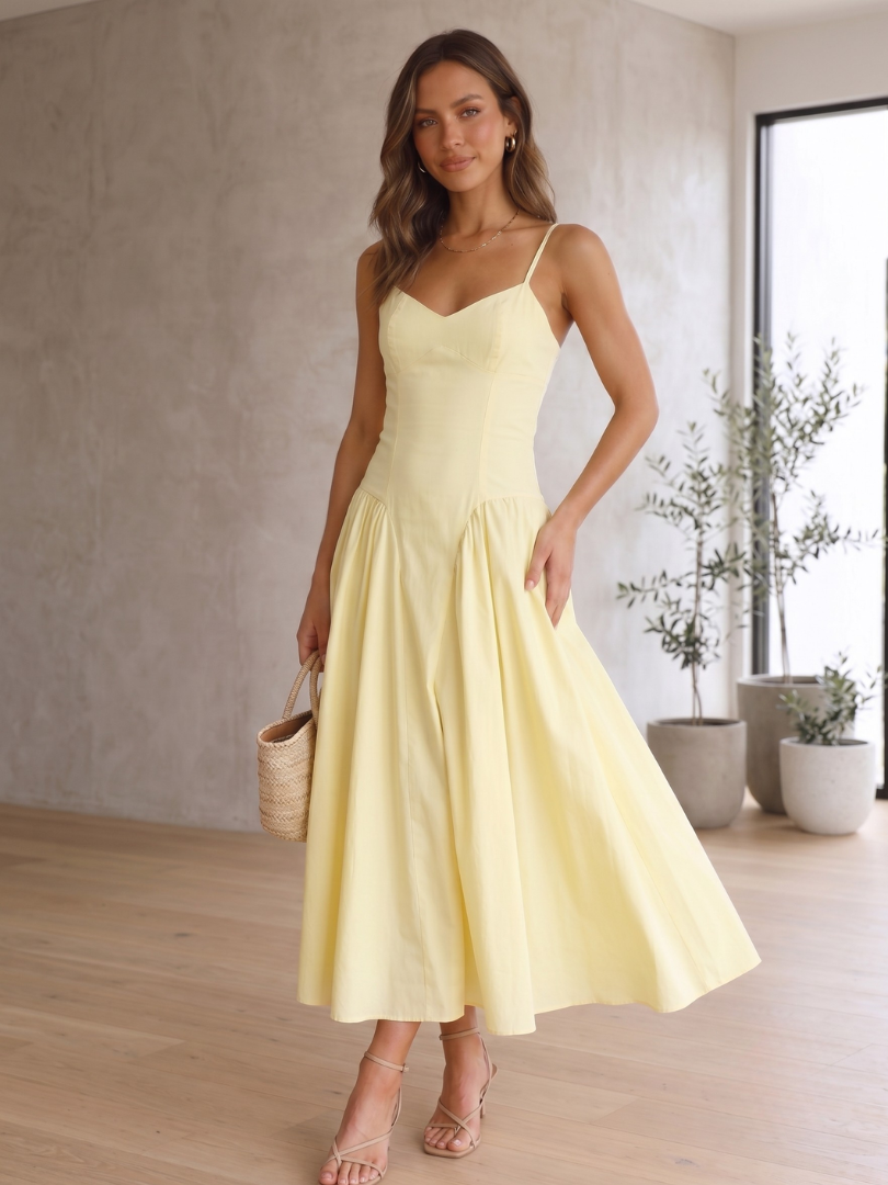 Women's lemon yellow babydoll midi dress with corset bodice, spaghetti straps & sweetheart neckline, ideal for summer.