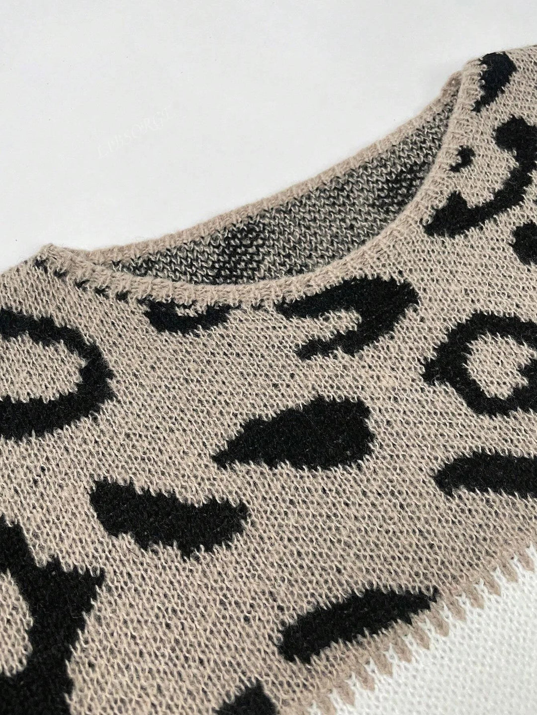 Modern women's leopard print color-block sweater. Chic, comfortable, and warm for autumn winter outfits.