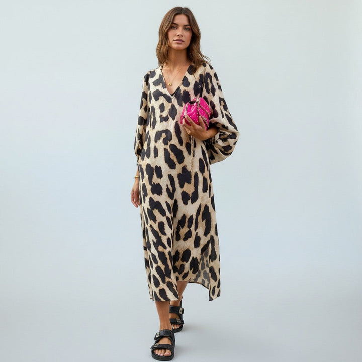 Elegant women's leopard print midi dress with a flattering silhouette, ideal for a chic and comfortable look.