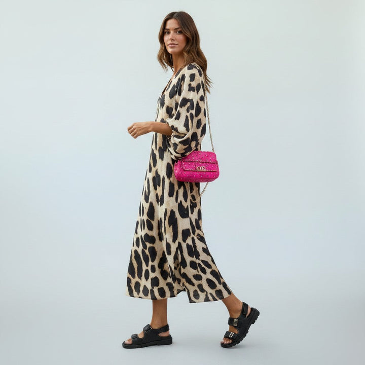 Versatile women's leopard print midi dress, featuring a flattering fit, suitable for any elegant occasion.
