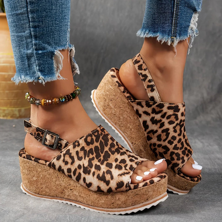 Chic women's leopard platform wedge sandals, perfect for summer vacations. Features comfortable adjustable ankle strap.