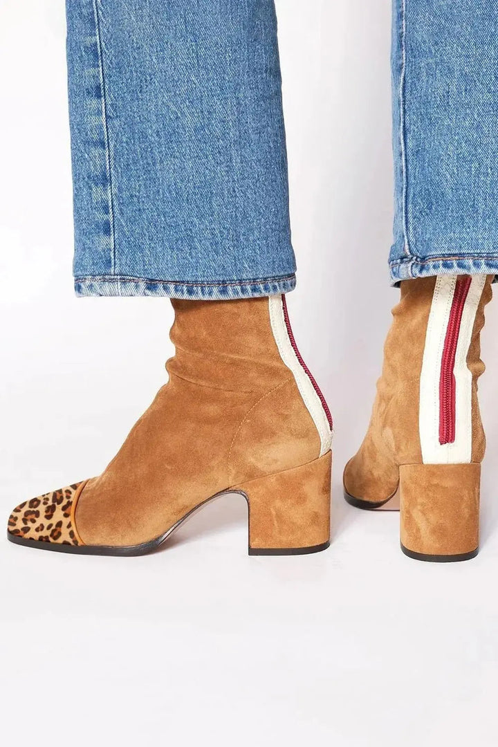 Elegant women's leopard print square toe boots, comfortable block heel for modern footwear style.