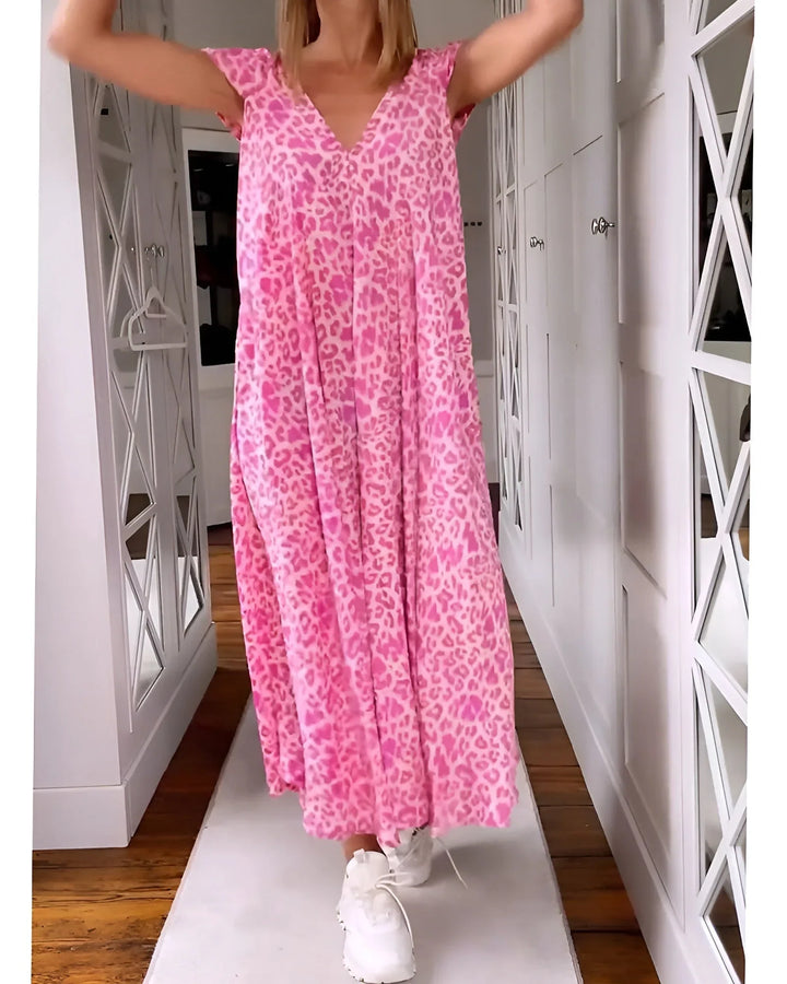 Women's leopard print V-neck maxi dress with short sleeves. Elegant loose fit for summer fashion.