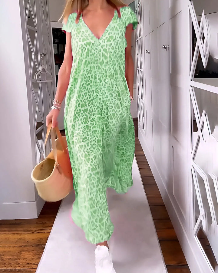 Fashionable women's patterned maxi dress. Leopard print V-neck, short sleeve, perfect for warm weather.
