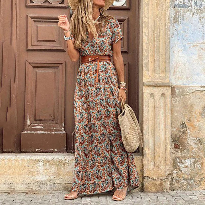 Women's light brown patterned maxi dress with a stylish belt and short sleeves, perfect for summer casual wear.
