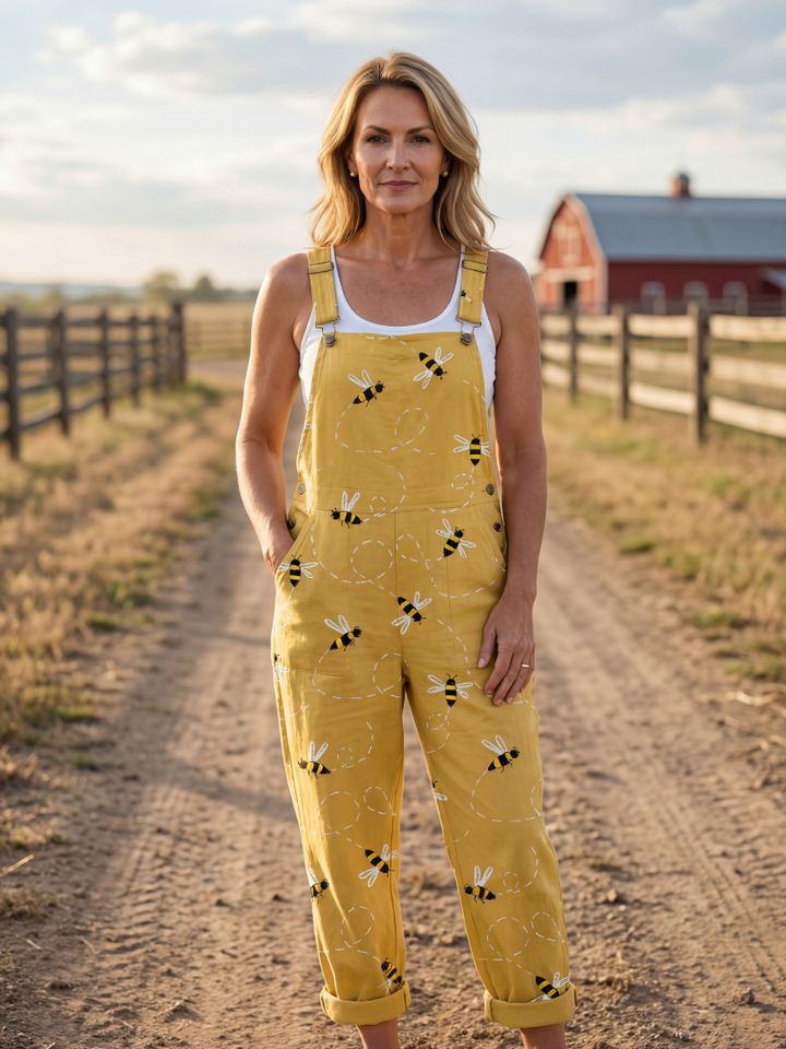 Women's light honeybee print relaxed fit jumpsuit with wide straps, perfect for comfortable summer casual wear.