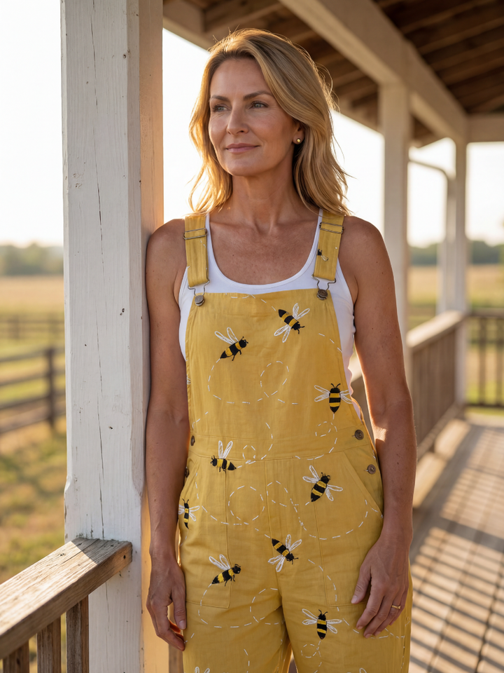 Stylish women's full-length honeybee print jumpsuit. Relaxed fit, wide straps, ideal for summer comfort and fashion.