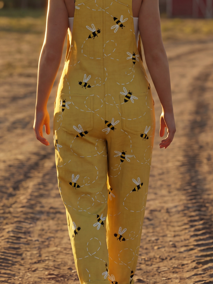 Women's light honeybee print full-length jumpsuit. Relaxed fit, wide straps for comfort, suitable for summer casual wear.
