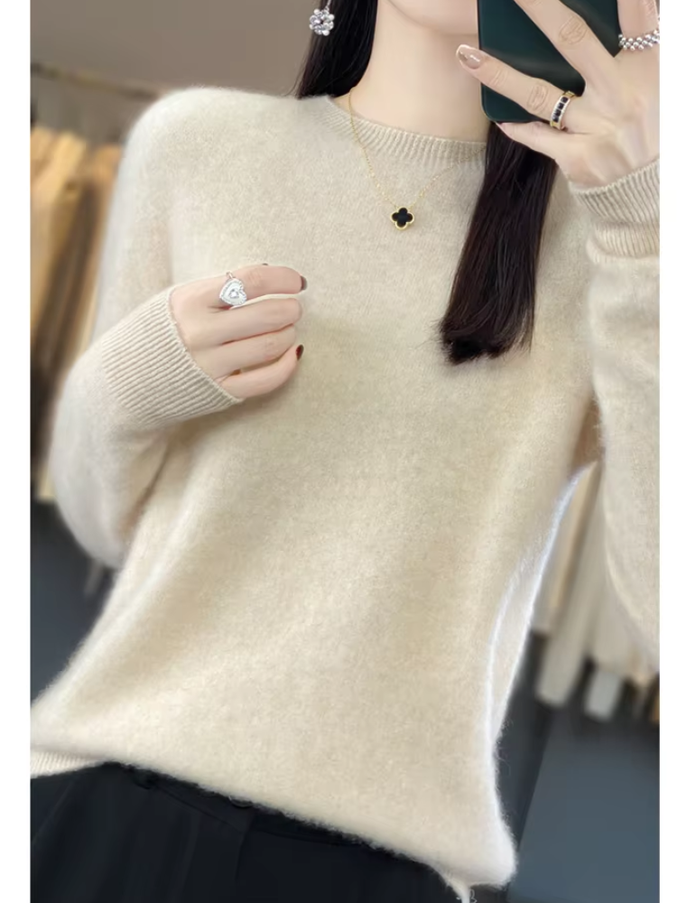 Women's all-season round neck sweater, soft knit fabric in a chic light pink color.