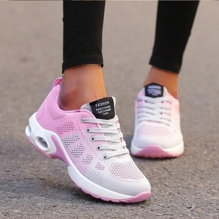 Woman running in comfortable lightweight athletic sneakers, ideal for training and active lifestyle.