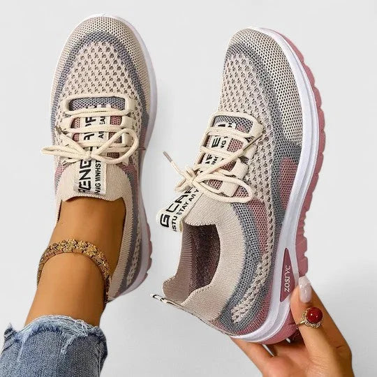 Sporty women's athletic sneakers, breathable design, offering ultimate comfort for active wear.