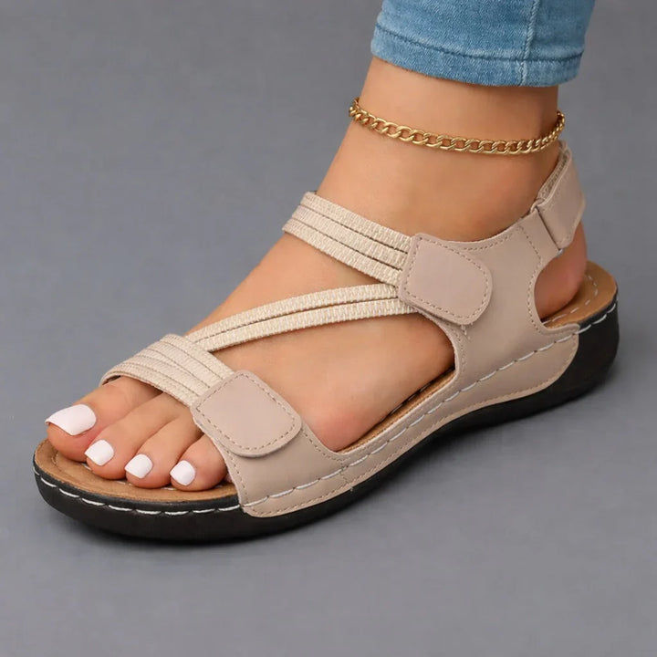 Pink women's supportive walking sandals, lightweight design with adjustable straps for everyday comfort.