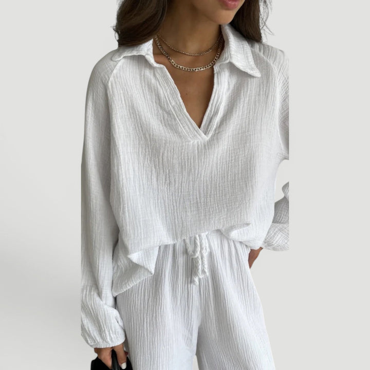 Full body shot of a woman in a lightweight, breathable cotton gauze co-ord set, ideal summer travel wear.