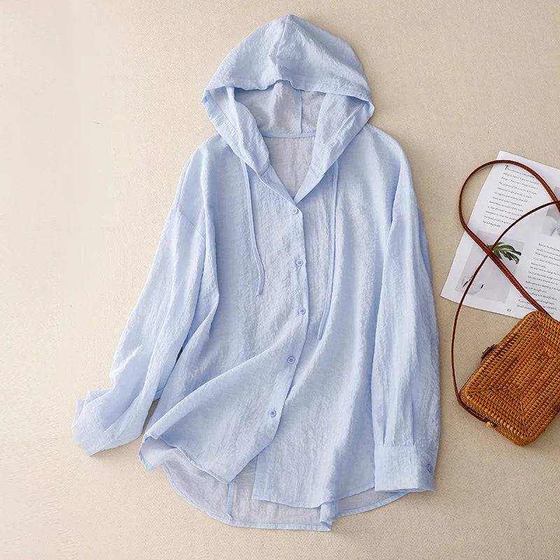 Front view of women's crinkled button-front hoodie. Lightweight design with drawstring hood, great for layering.