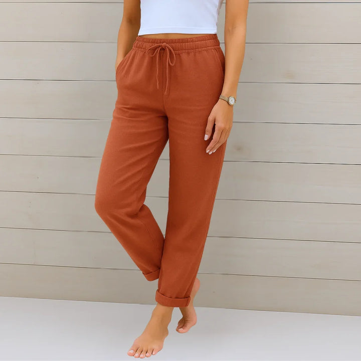 Close-up of lightweight women's drawstring pants, showing soft fabric & comfortable relaxed fit.