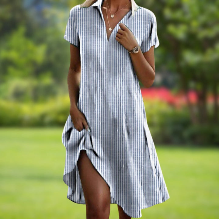 Stylish women's spring floral midi dress with a relaxed fit, comfortable for any warm-weather occasion.
