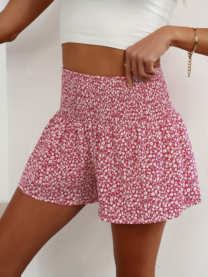Ladies' comfortable floral print summer shorts with elastic waistband for casual wear.