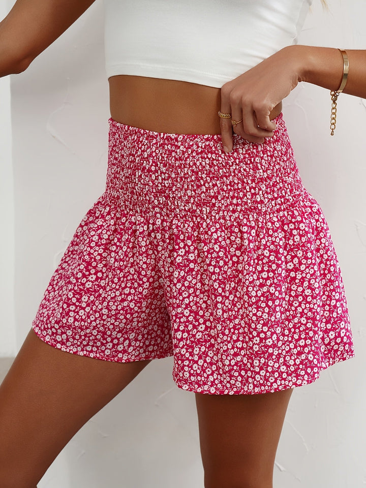 Women's elastic waist summer shorts featuring a beautiful floral pattern.