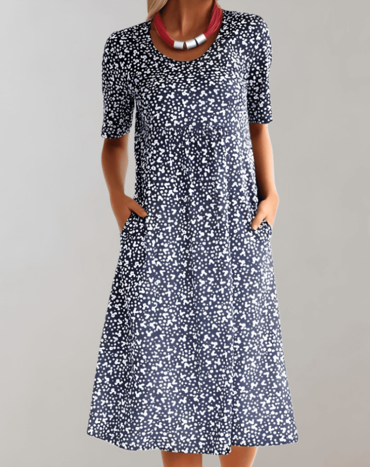Flowy, lightweight V-neck midi summer dress for women, offering effortless style and comfort for warm days.