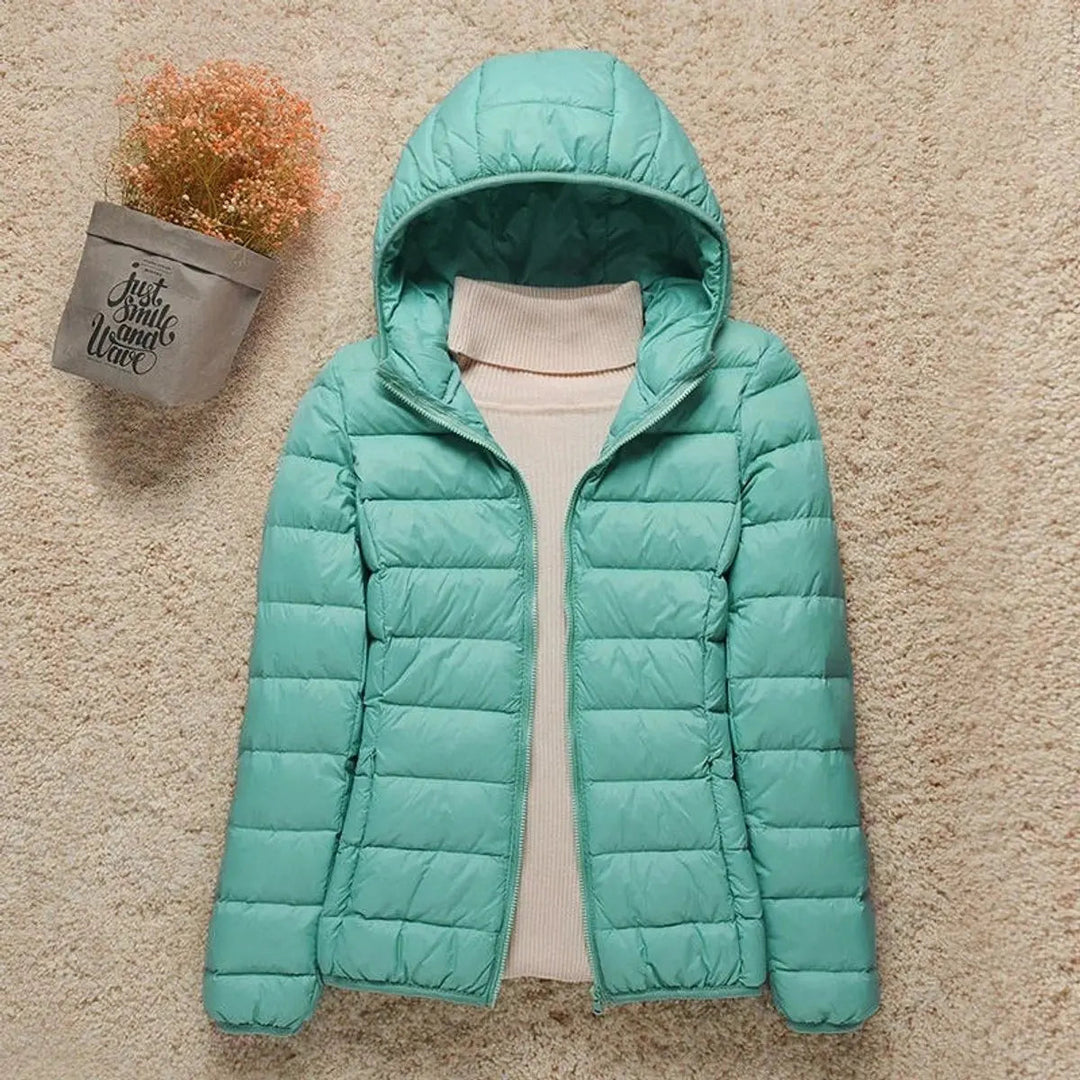 Women's lightweight quilted hooded puffer jacket. Excellent travel jacket, warm & easy to pack.