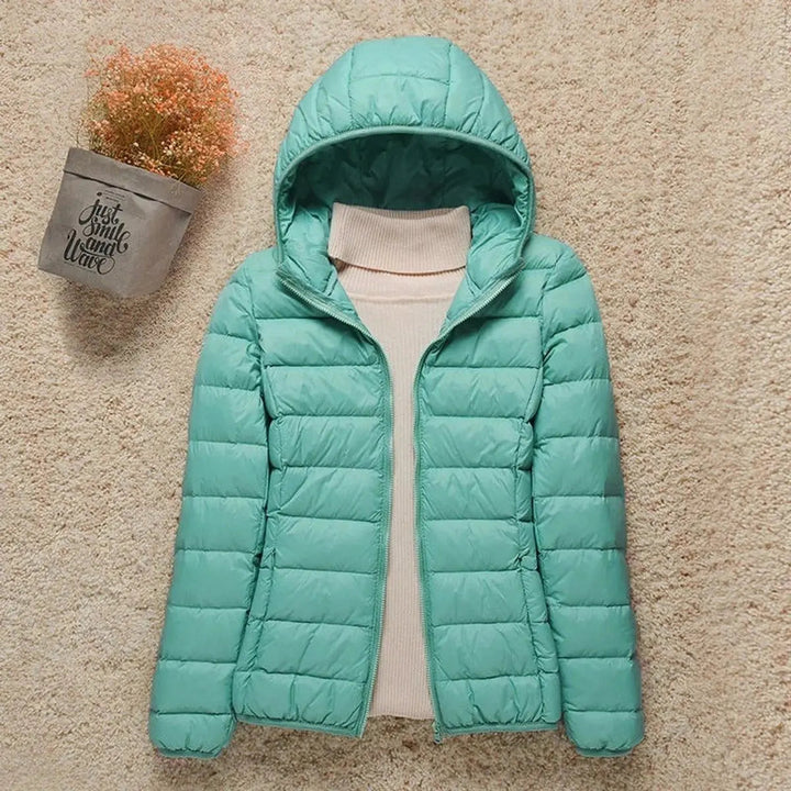 Women's lightweight quilted hooded puffer jacket. Excellent travel jacket, warm & easy to pack.