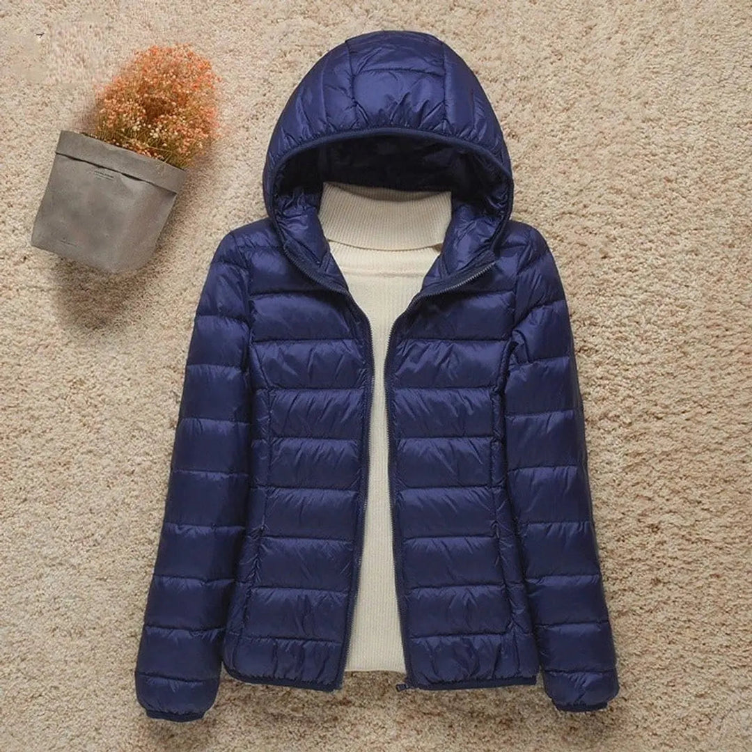 Versatile women's hooded quilted puffer jacket. Lightweight, packable outerwear for autumn & winter fashion.