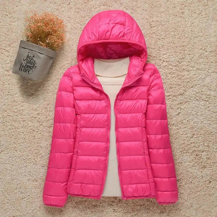 Casual women's hooded puffer jacket, quilted & lightweight. Great activewear for autumn/winter adventures.