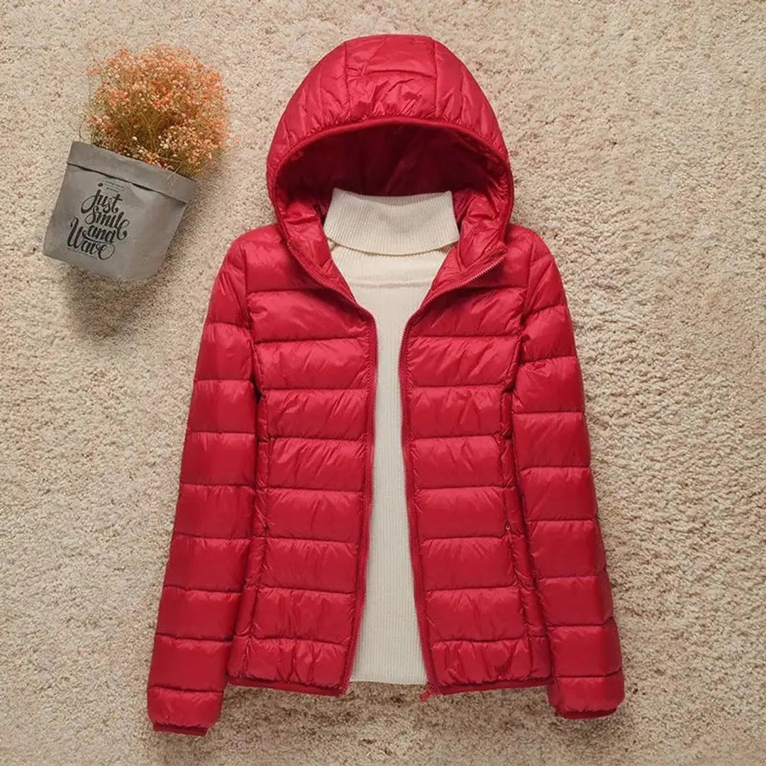 Women's lightweight hooded quilted puffer jacket. Essential warm outerwear for stylish autumn & winter days.