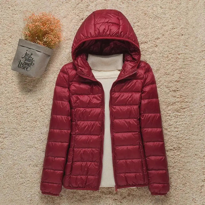 Women's packable hooded quilted puffer jacket. Lightweight, warm, and stylish for daily wear & travel.