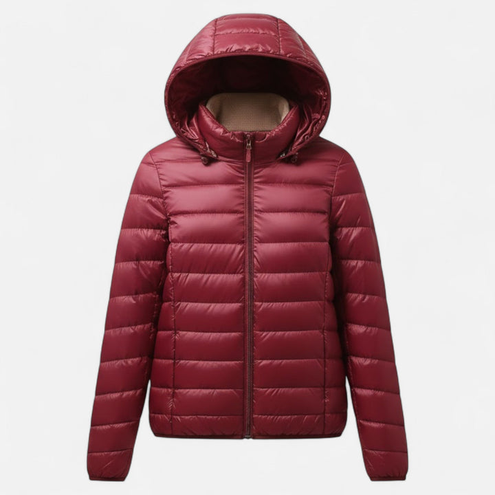 Experience lightweight comfort with this plus-size women's down jacket.