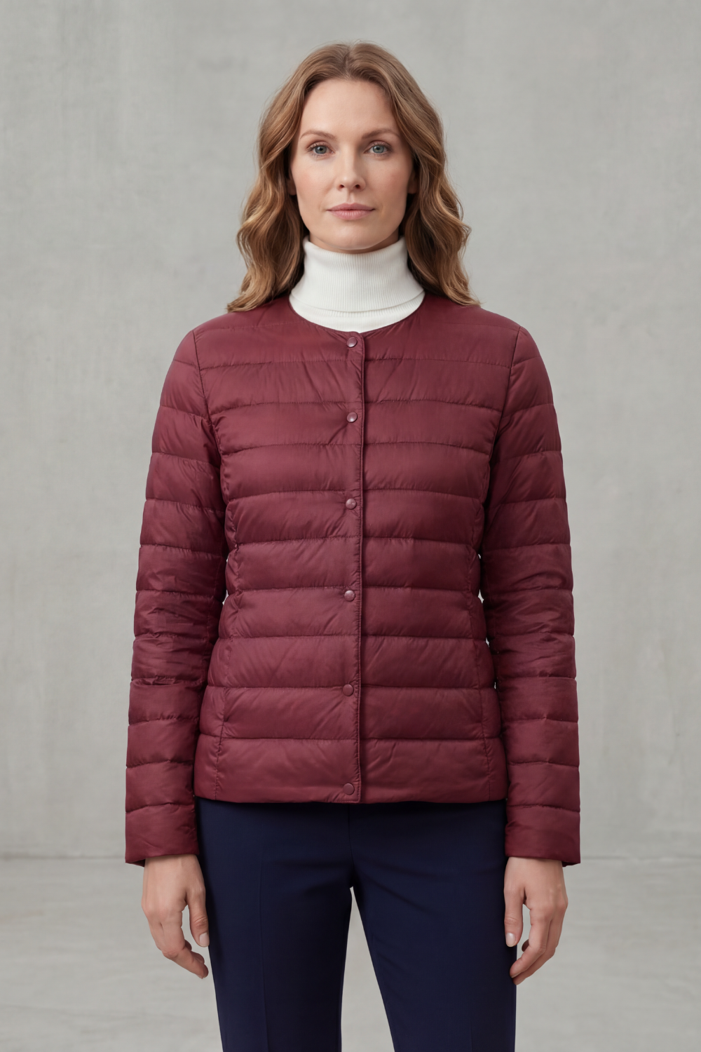 Essential women's lightweight puffer jacket, ideal for layering and warmth.