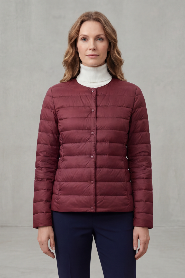 Essential women's lightweight puffer jacket, ideal for layering and warmth.