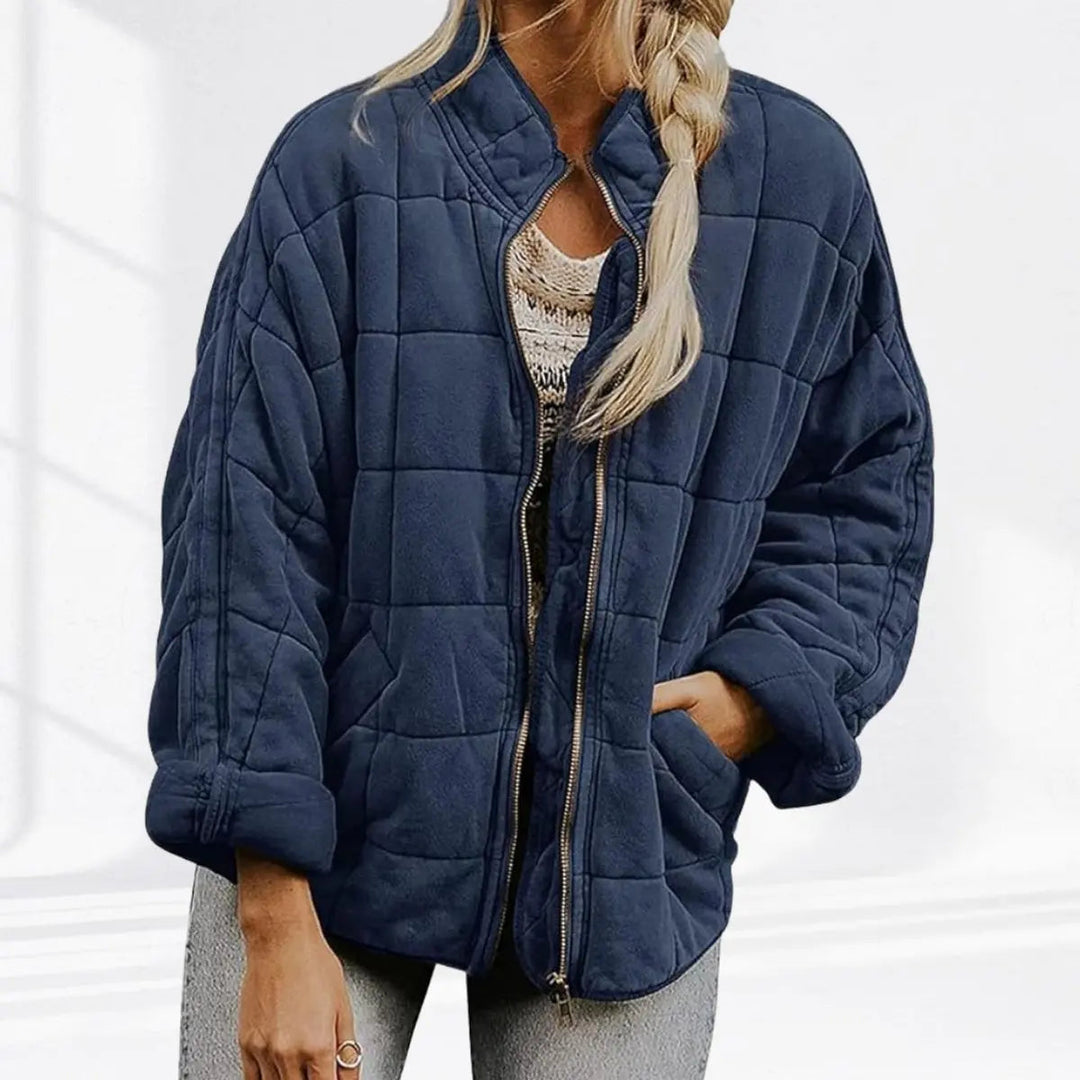 Essential women's lightweight jacket. Quilted, padded, with a stand collar. Great for casual outings.
