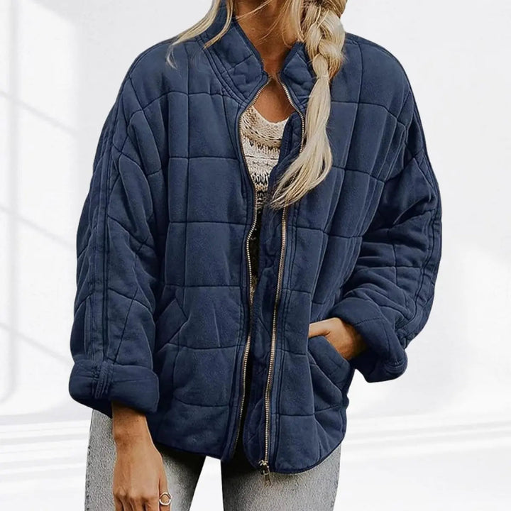 Essential women's lightweight jacket. Quilted, padded, with a stand collar. Great for casual outings.