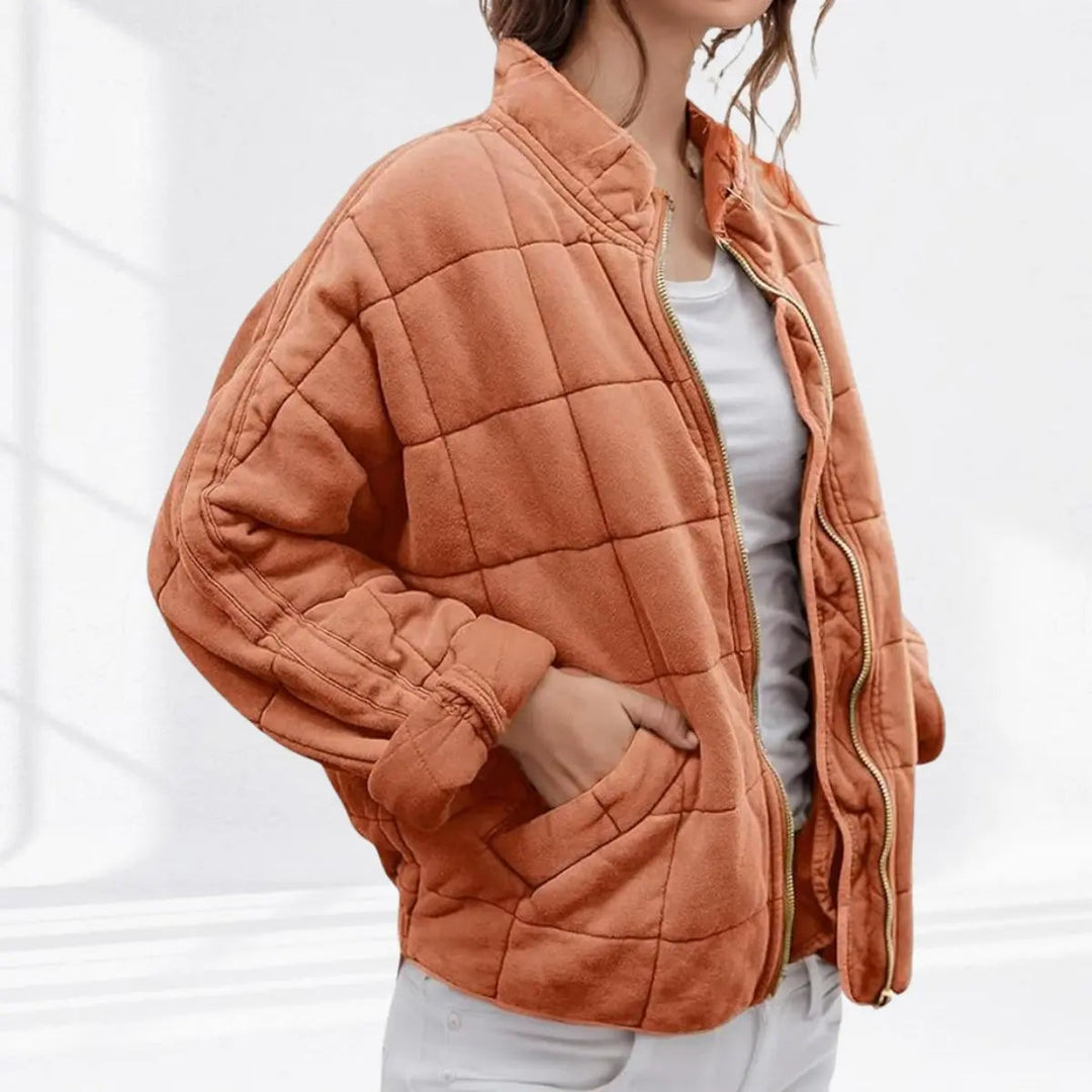 Warm & lightweight women's quilted jacket. Padded for comfort, featuring a stylish stand collar design.