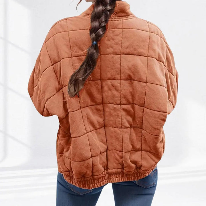 Modern women's stand collar quilted jacket. Lightweight, padded, and perfect for versatile casual wear.