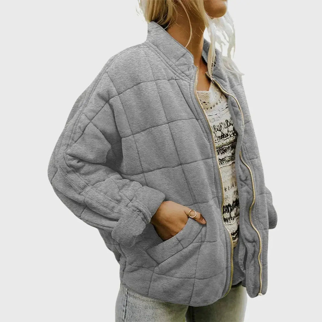 Autumn style women's jacket: a lightweight, quilted, padded coat with a practical stand collar.