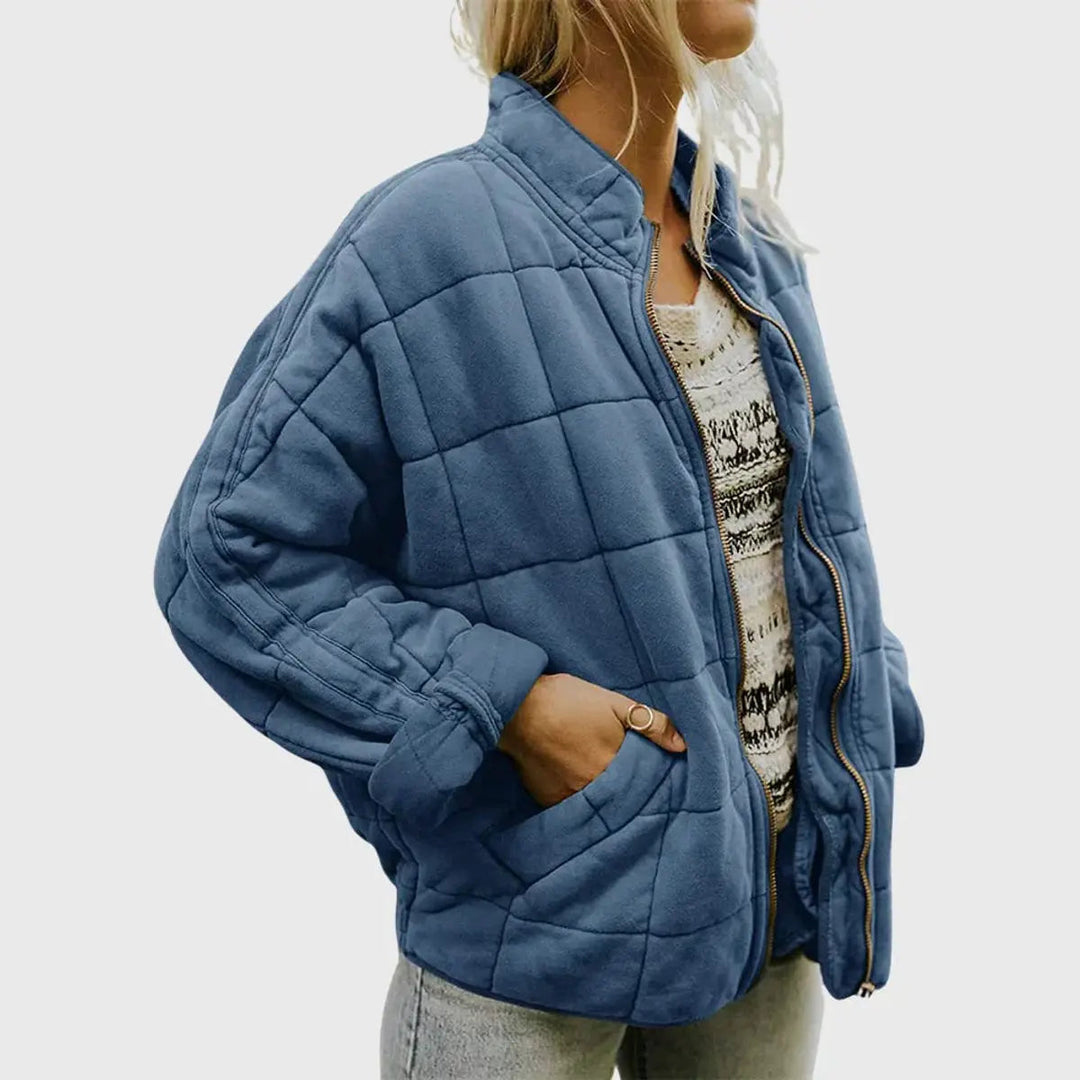 Zip-up women's lightweight quilted jacket. Padded for warmth, designed with a trendy stand collar.
